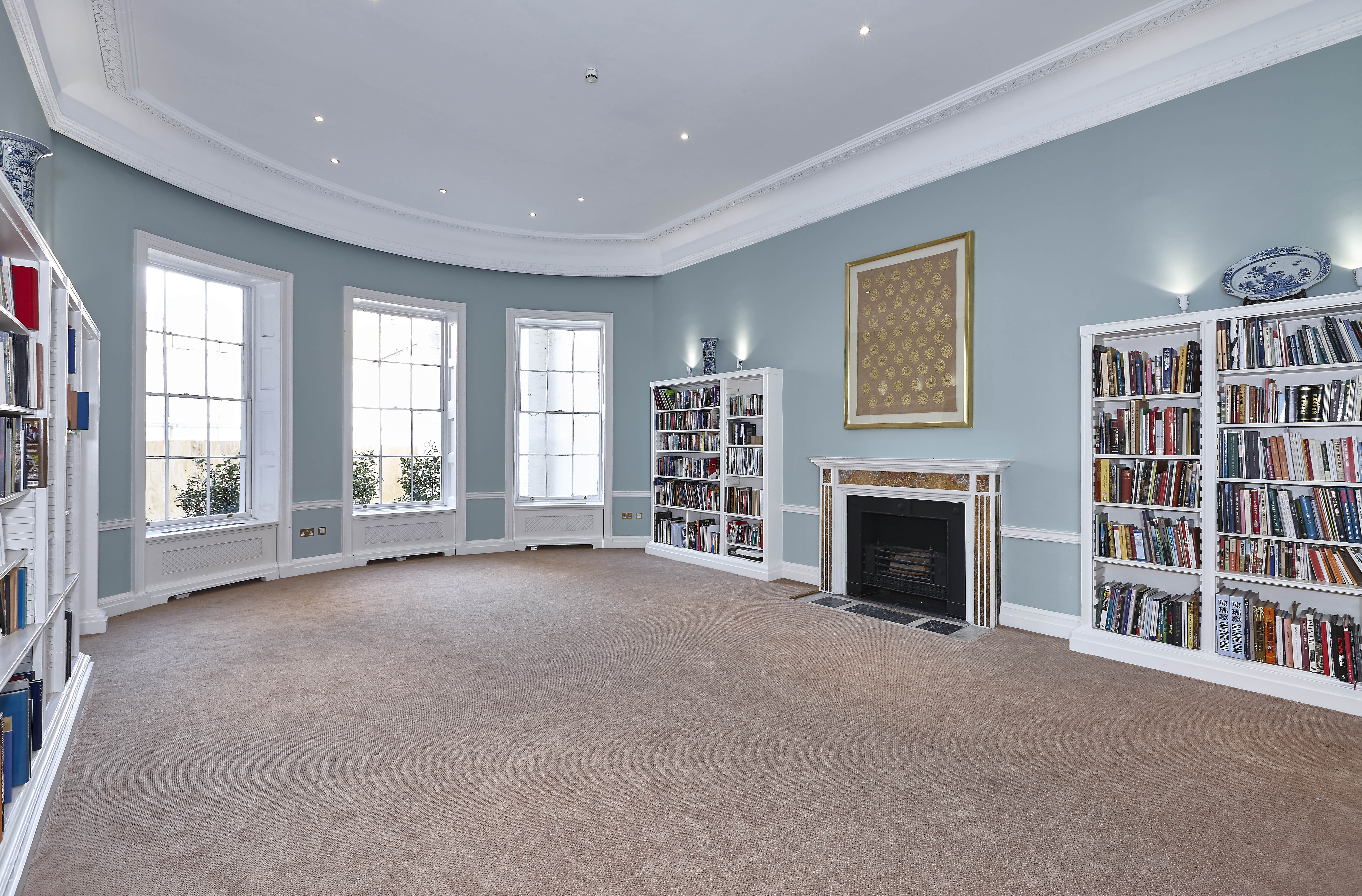 Elegant meeting room in Asia House with natural light, ideal for gatherings and presentations.