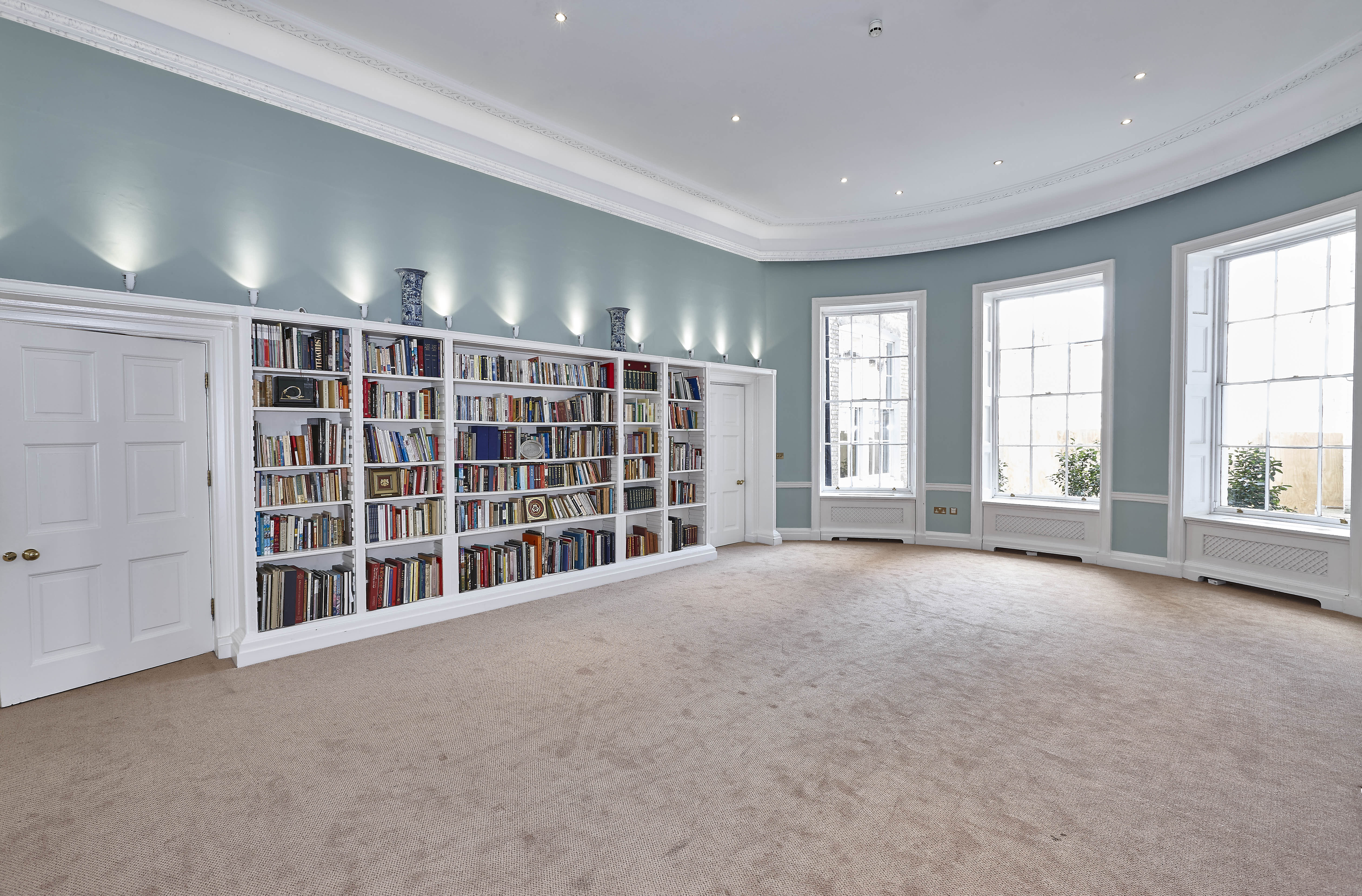 Elegant meeting room with large windows, perfect for workshops and presentations.