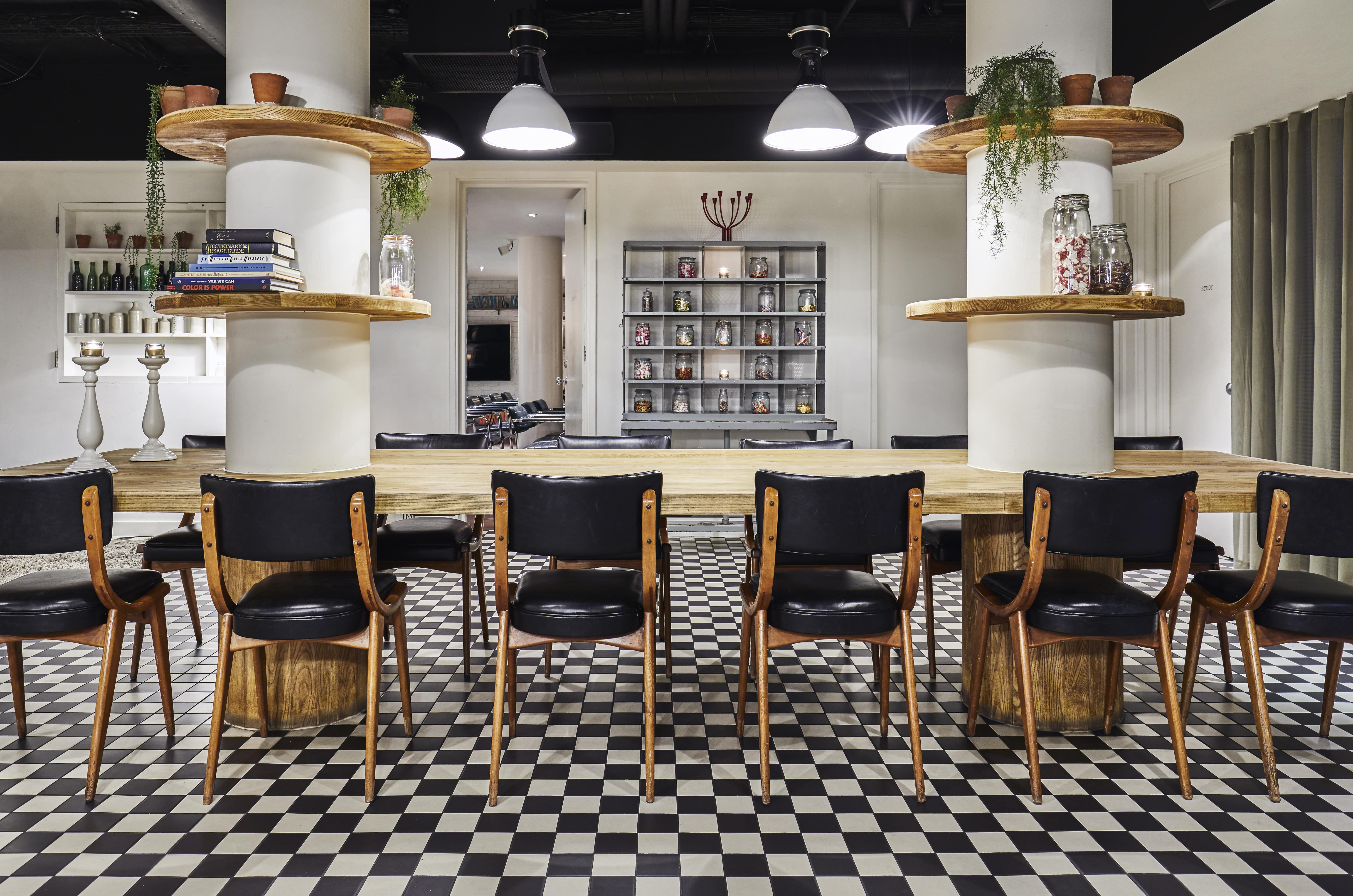 Modern meeting space with wooden table, ideal for events and gatherings in Shoreditch.