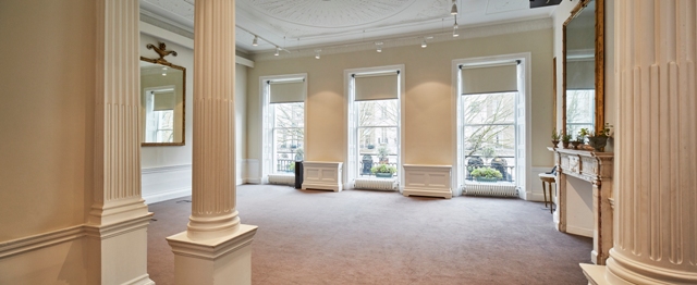 Spacious meeting room with large windows at 41 Portland Place for corporate events.