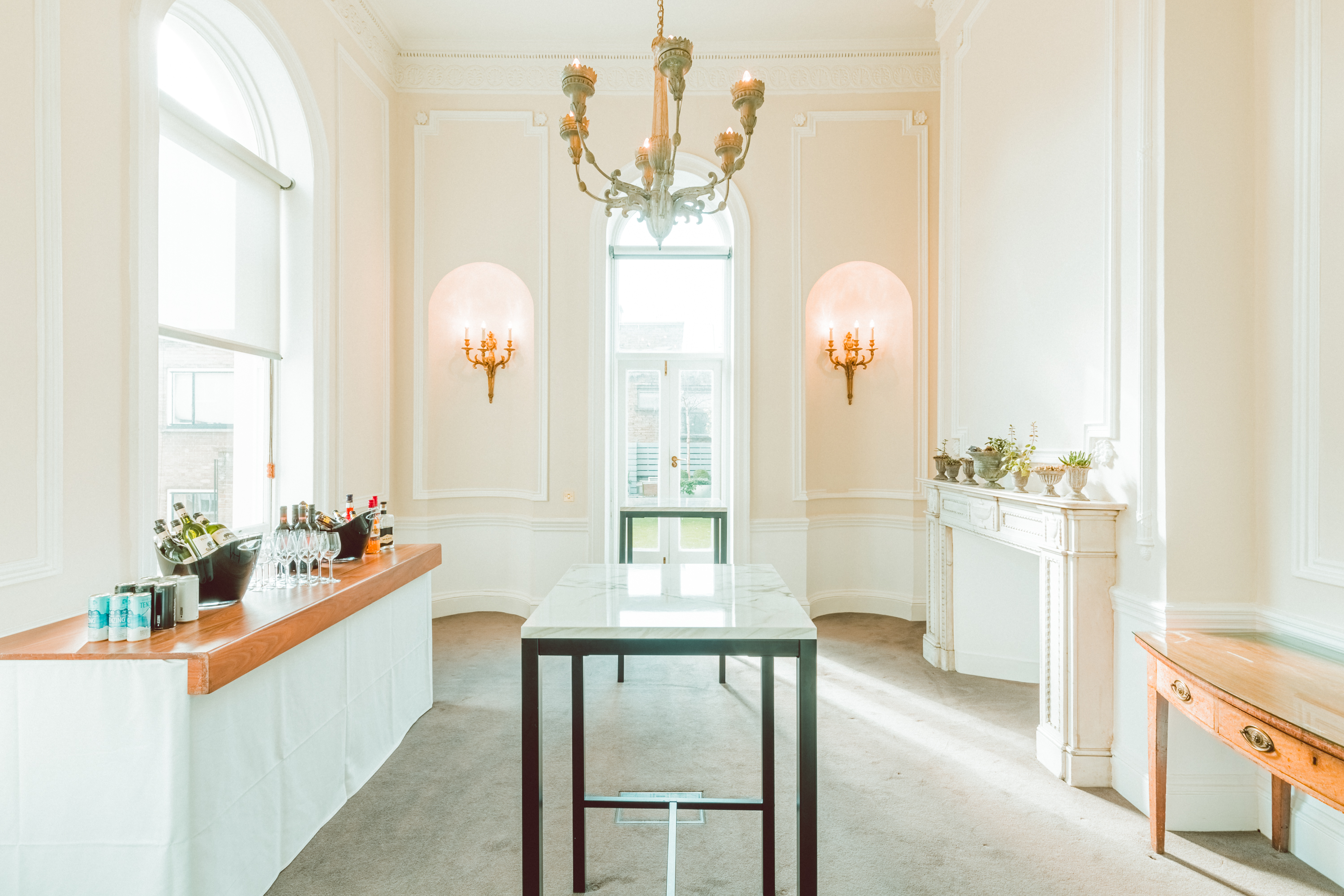 Elegant wedding venue with large windows, perfect for networking and social events.