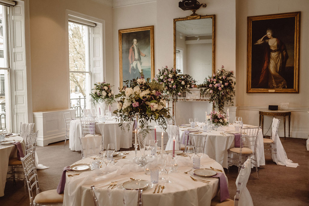 Elegant wedding venue with floral centerpieces and natural light at 41 Portland Place.