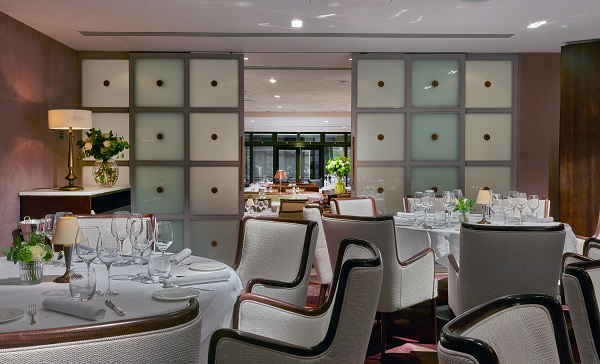 Private dining room in Sartoria with elegant table settings for corporate events.