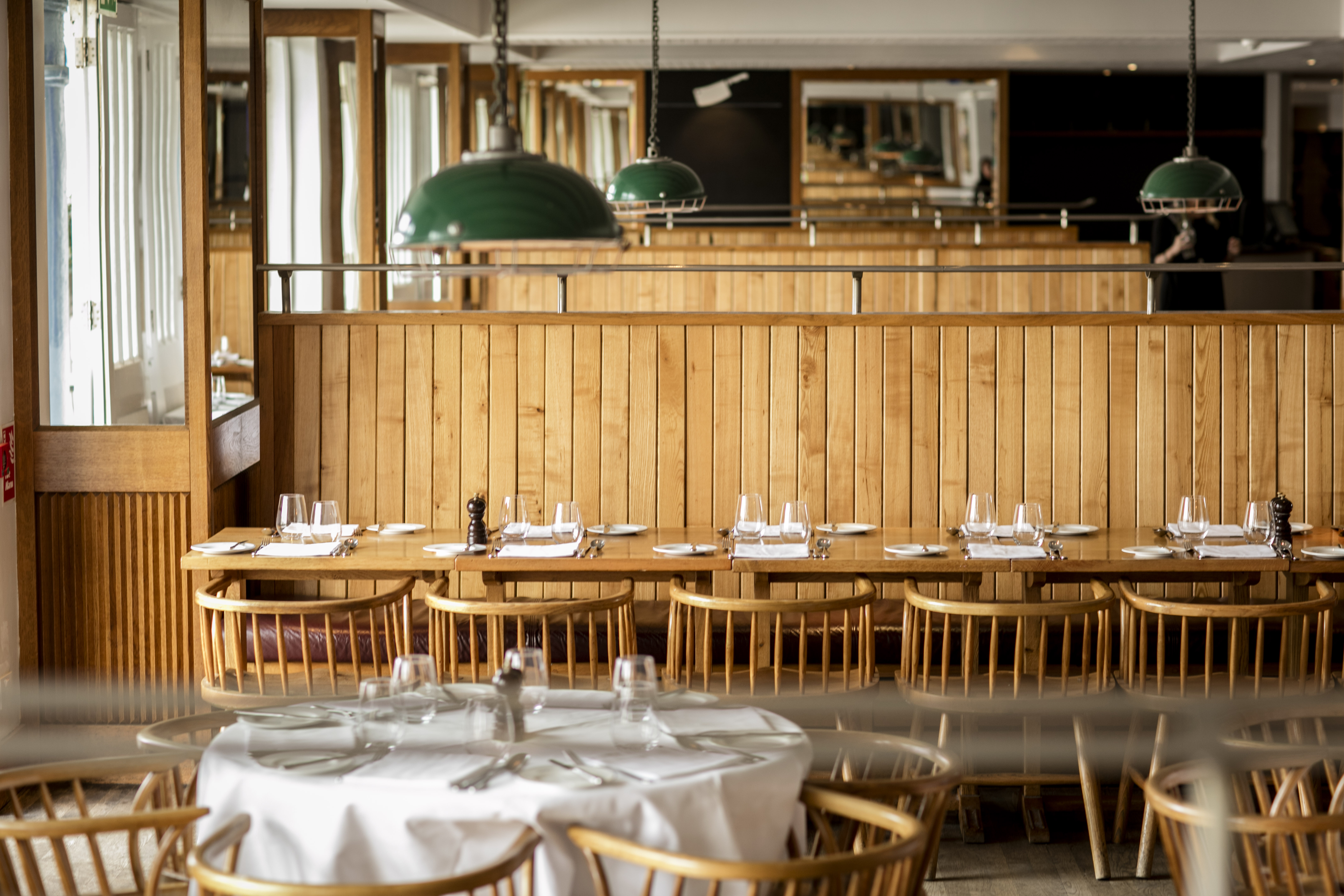 Intimate dining venue at Butlers Wharf Chop House with warm wooden accents.