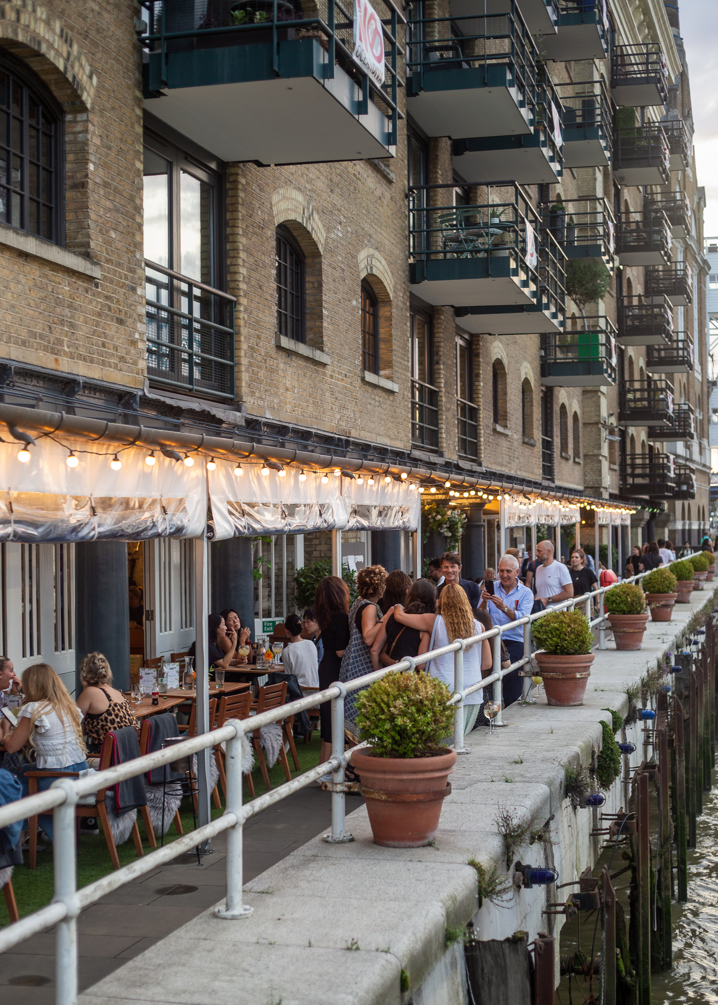 Outdoor dining at Butlers Wharf Chop House with string lights, ideal for social events.