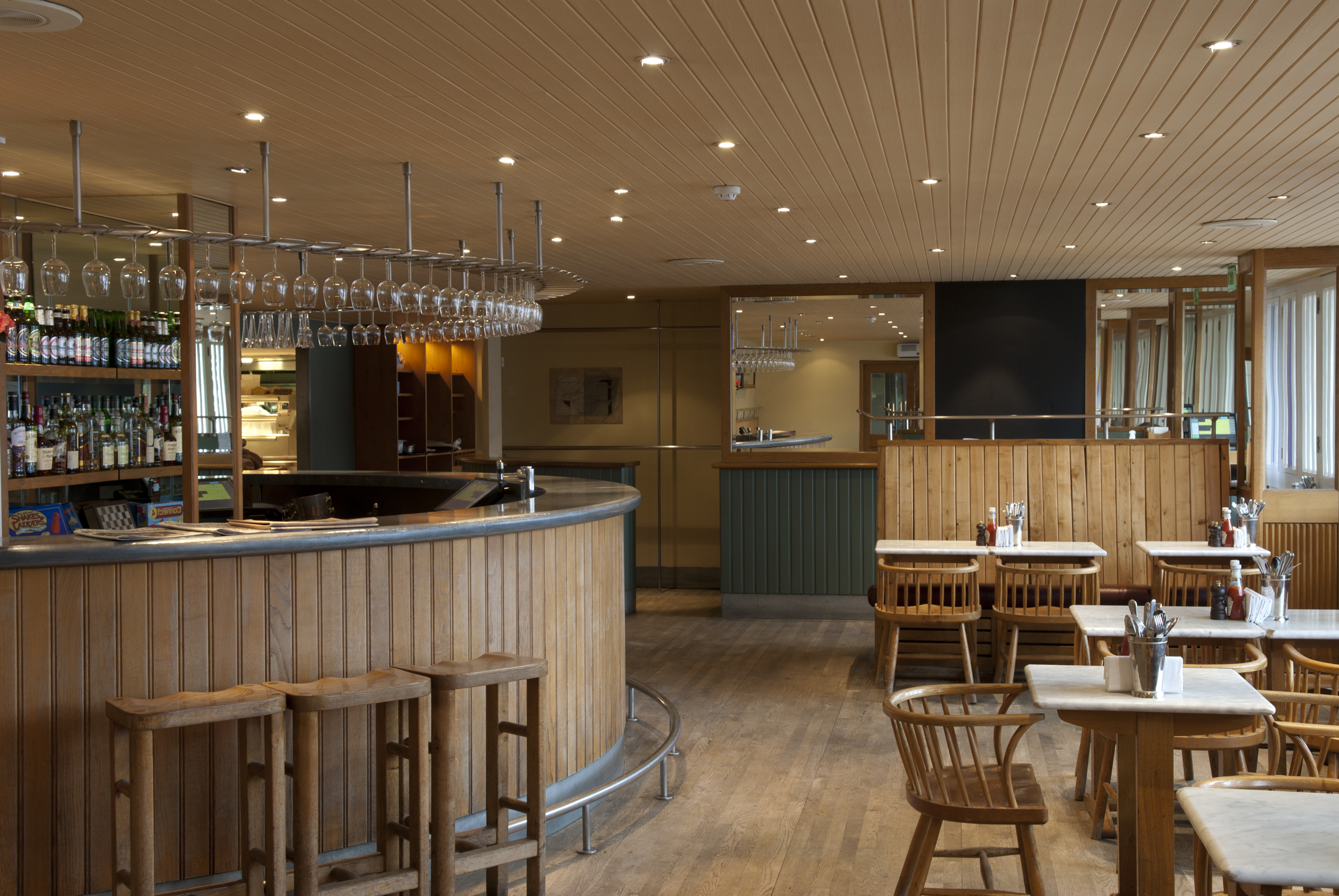 Modern bar at Butlers Wharf Chop House, cozy wood tones for networking events.
