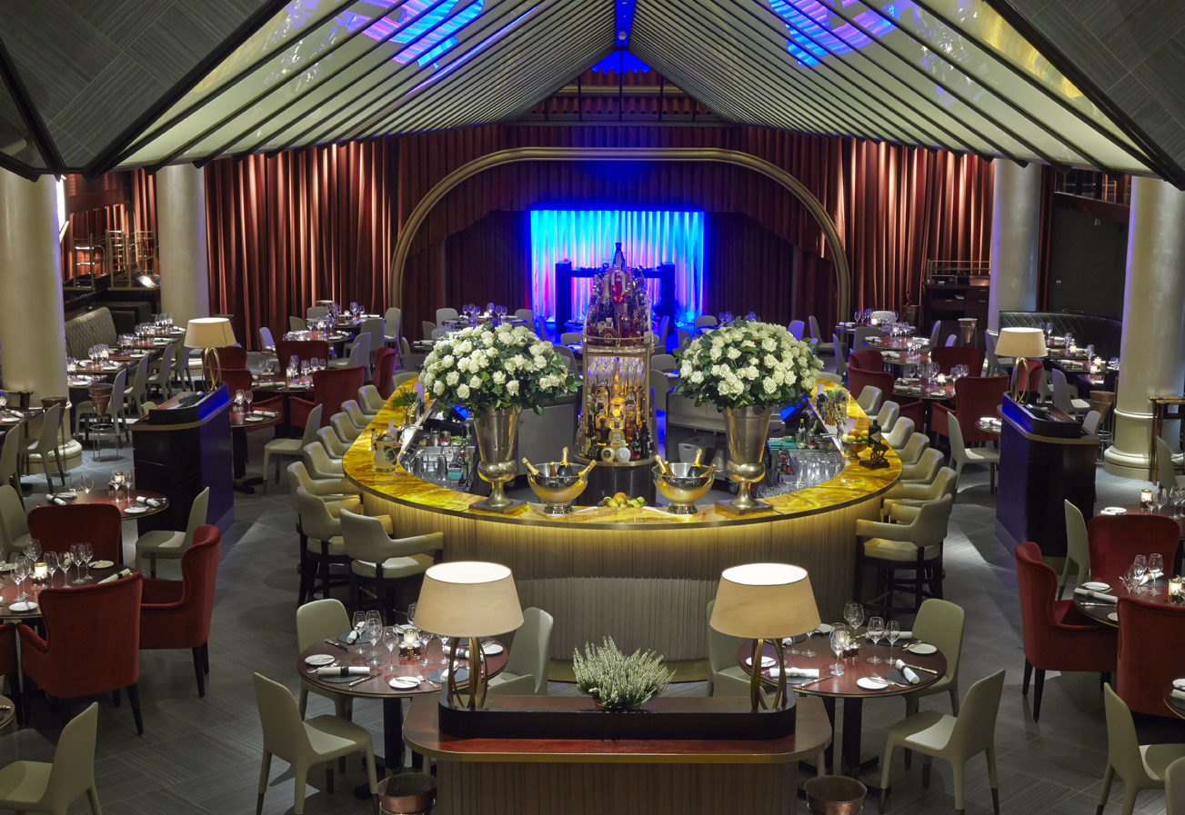 Sophisticated event space at Quaglino's with floral centerpieces for corporate events.