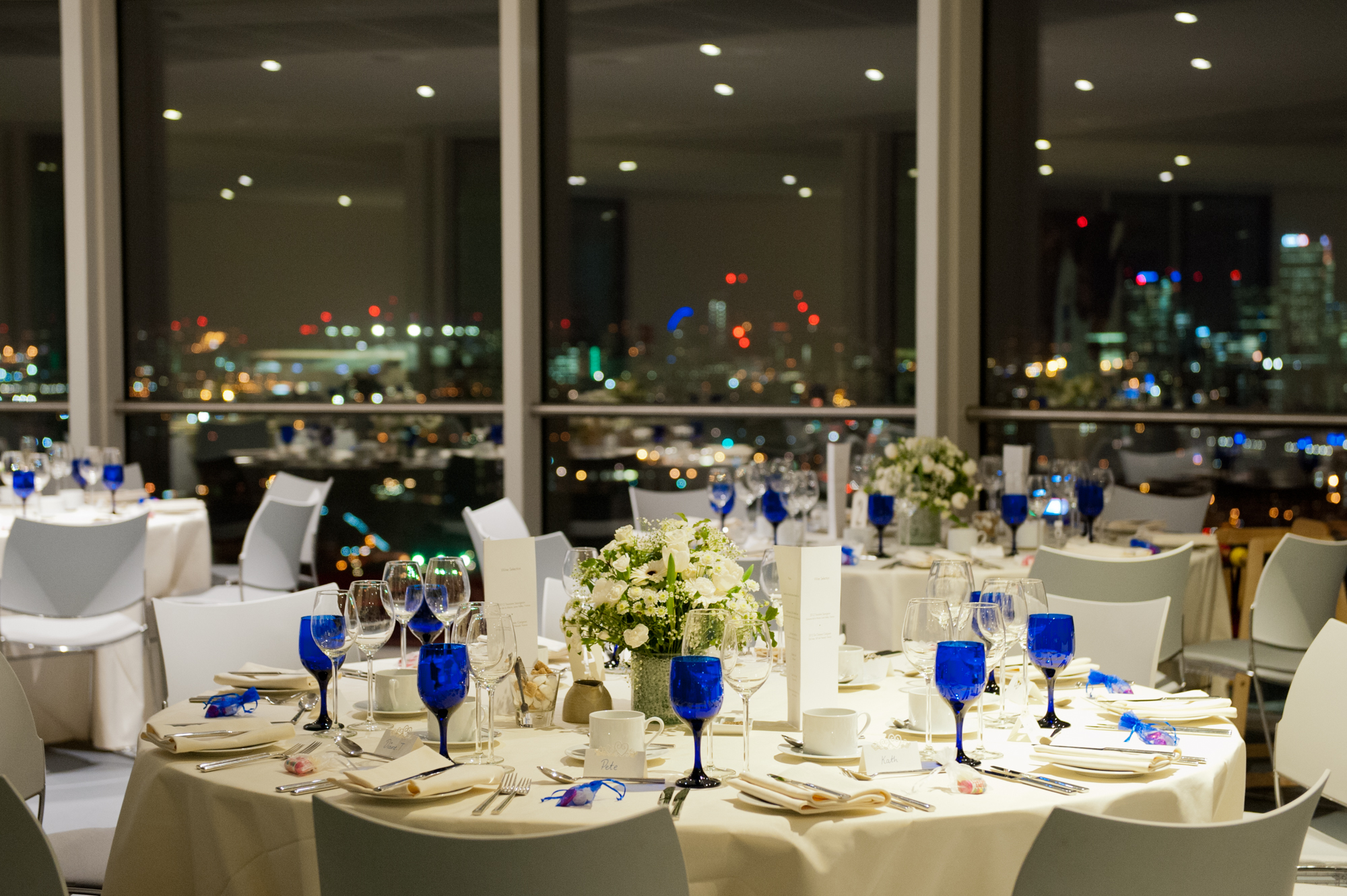 Elegant dining area at ArcelorMittal Orbit with city skyline, perfect for corporate events.