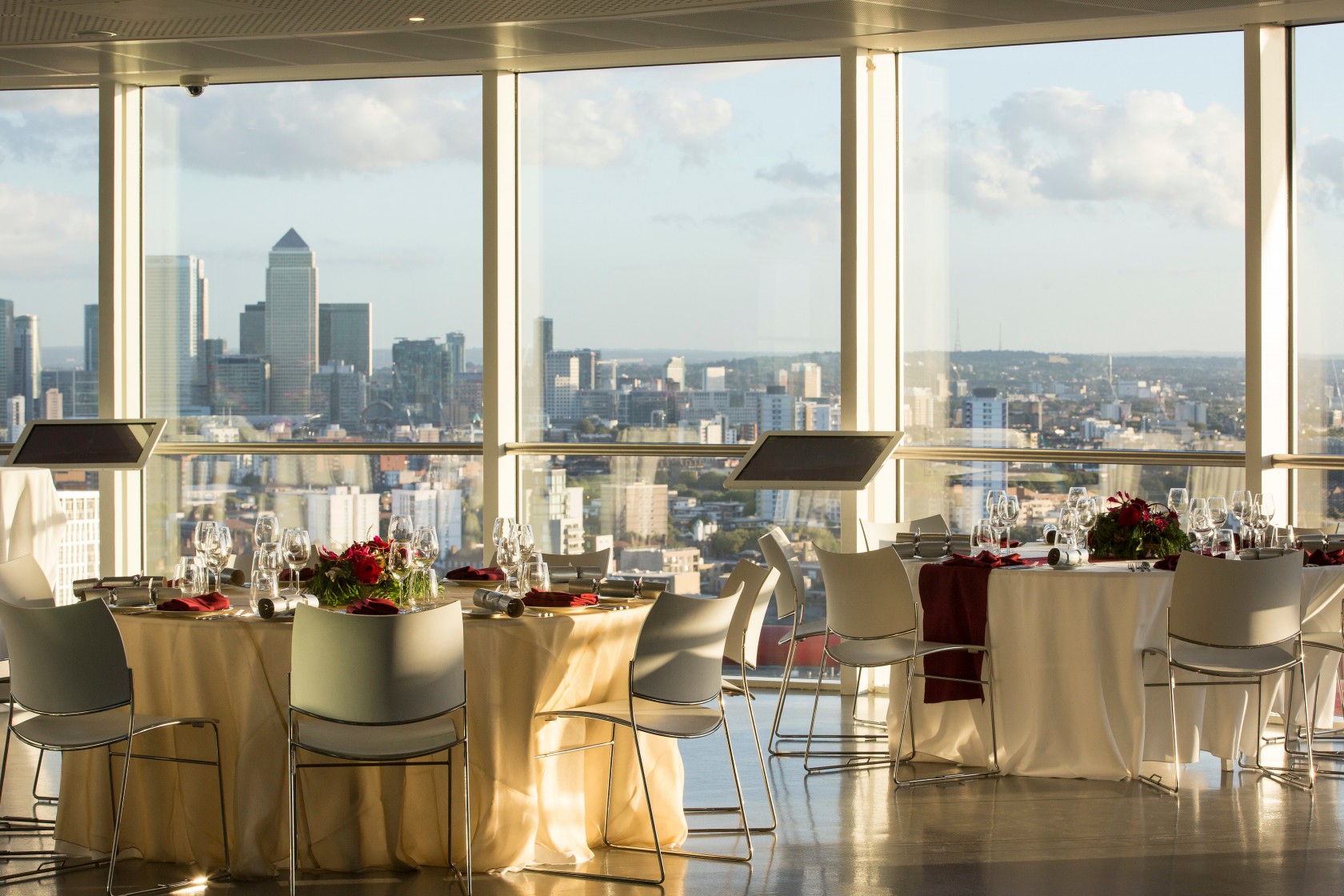 ArcelorMittal Orbit event space with elegant tables and city skyline views for corporate events.