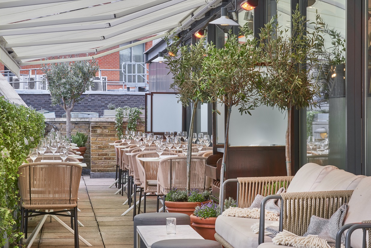 Stylish outdoor event space with elegant seating for intimate gatherings and upscale dining.