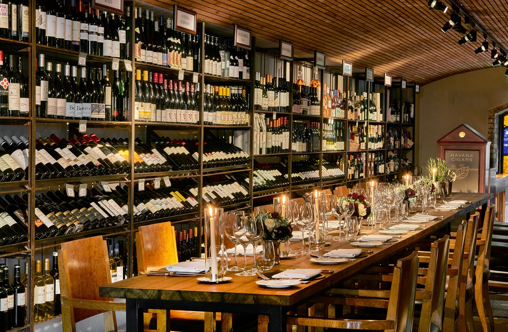 Elegant dining space in wine cellar for private dinners and exclusive events.