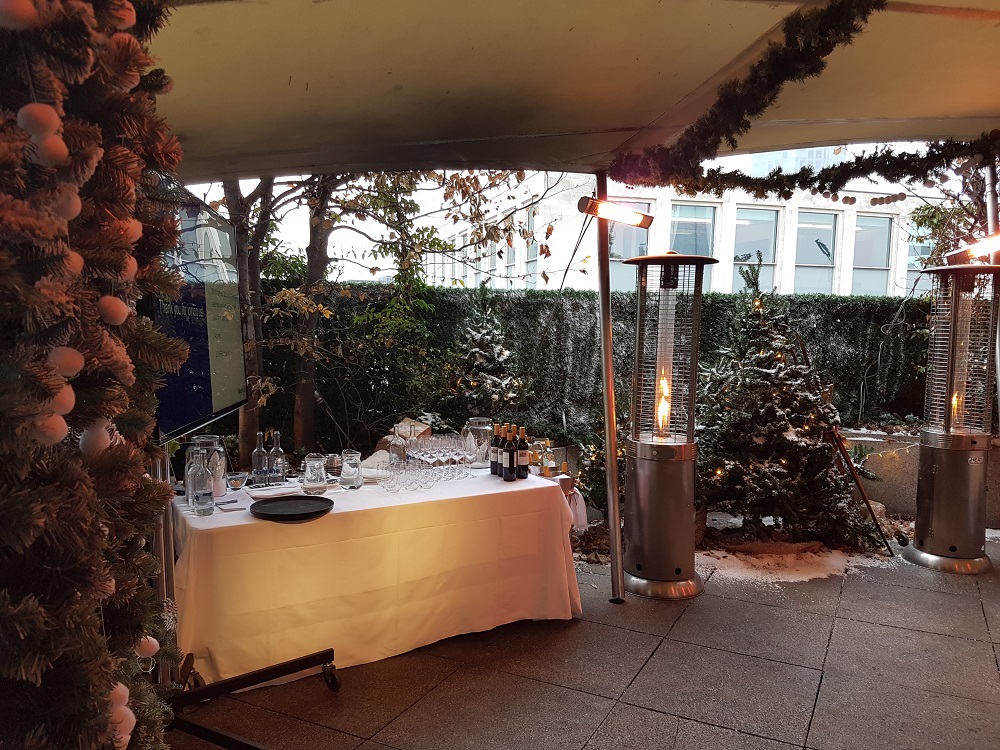 Bar Terrace at Coq d'Argent, elegant outdoor winter event space with festive decor.