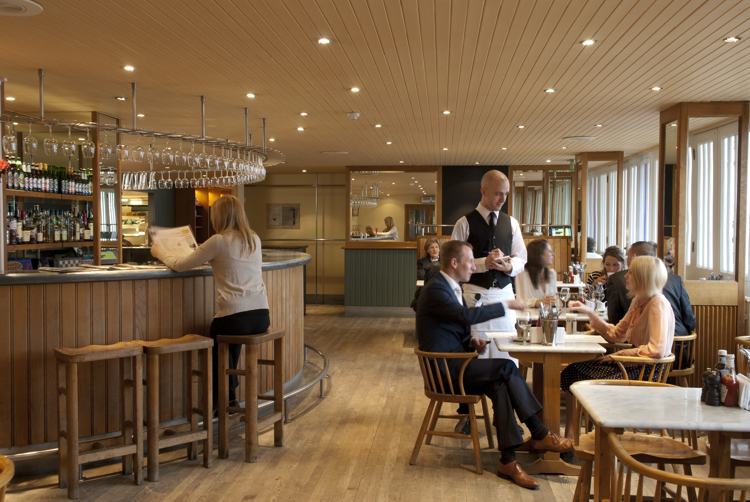 Bar at Butlers Wharf Chop House, warm wood tones, ideal for networking events.