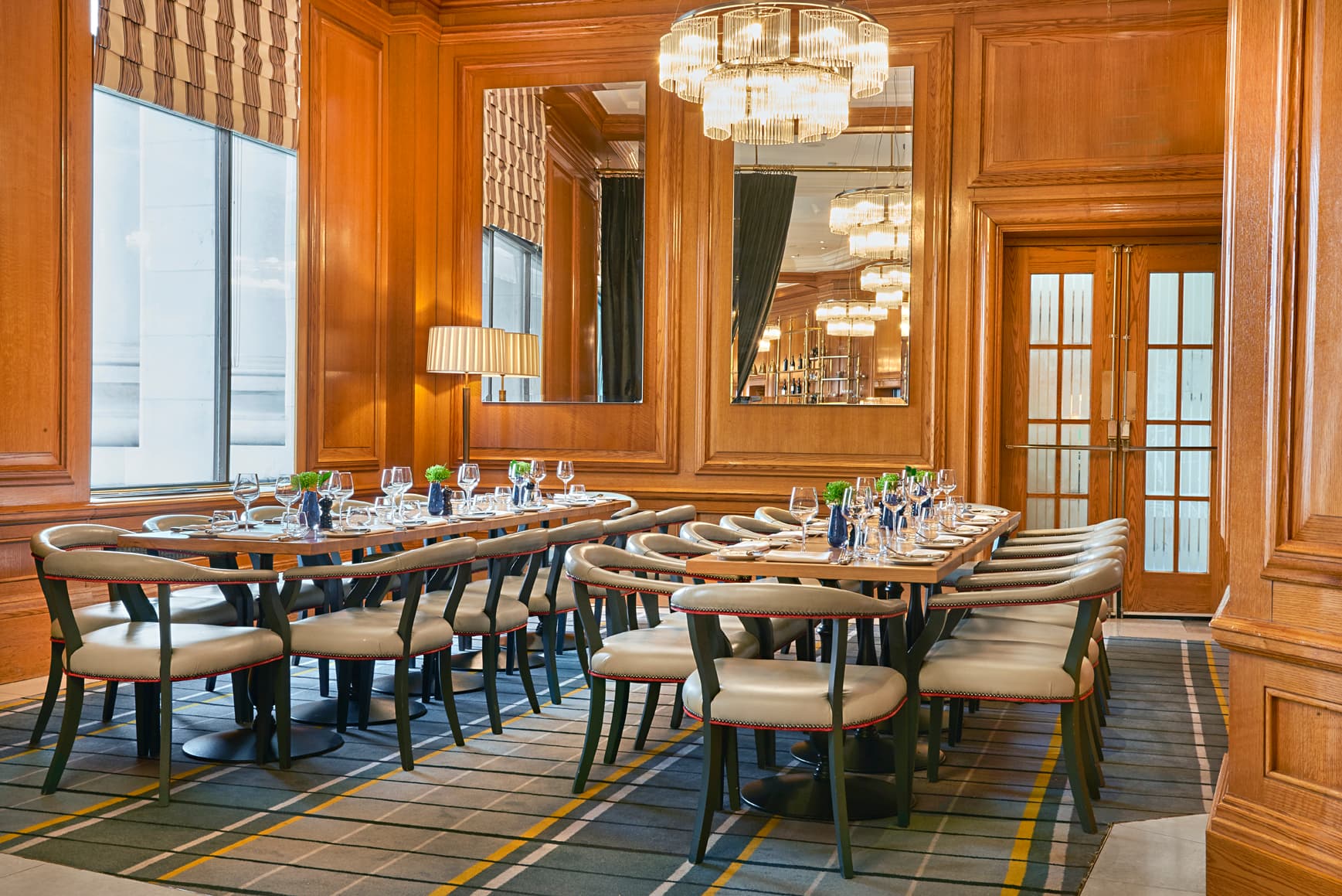 Gillray's Steakhouse wood-paneled private dining room for executive meetings and boardroom dinners.