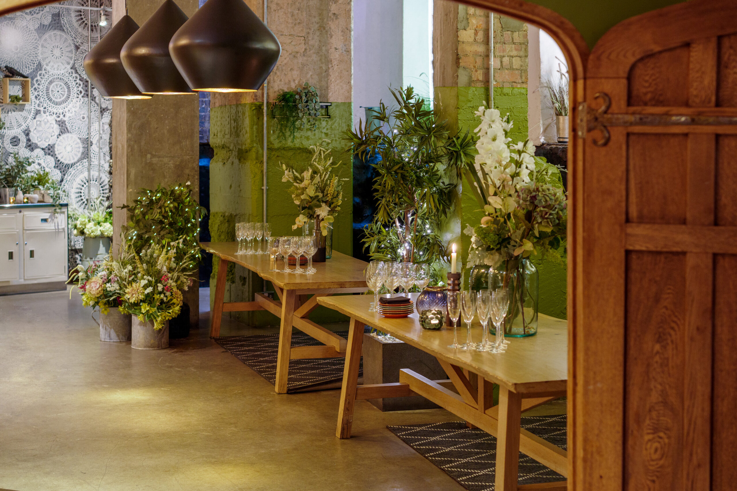 Elegant private event space with wooden tables, ideal for networking and celebrations.