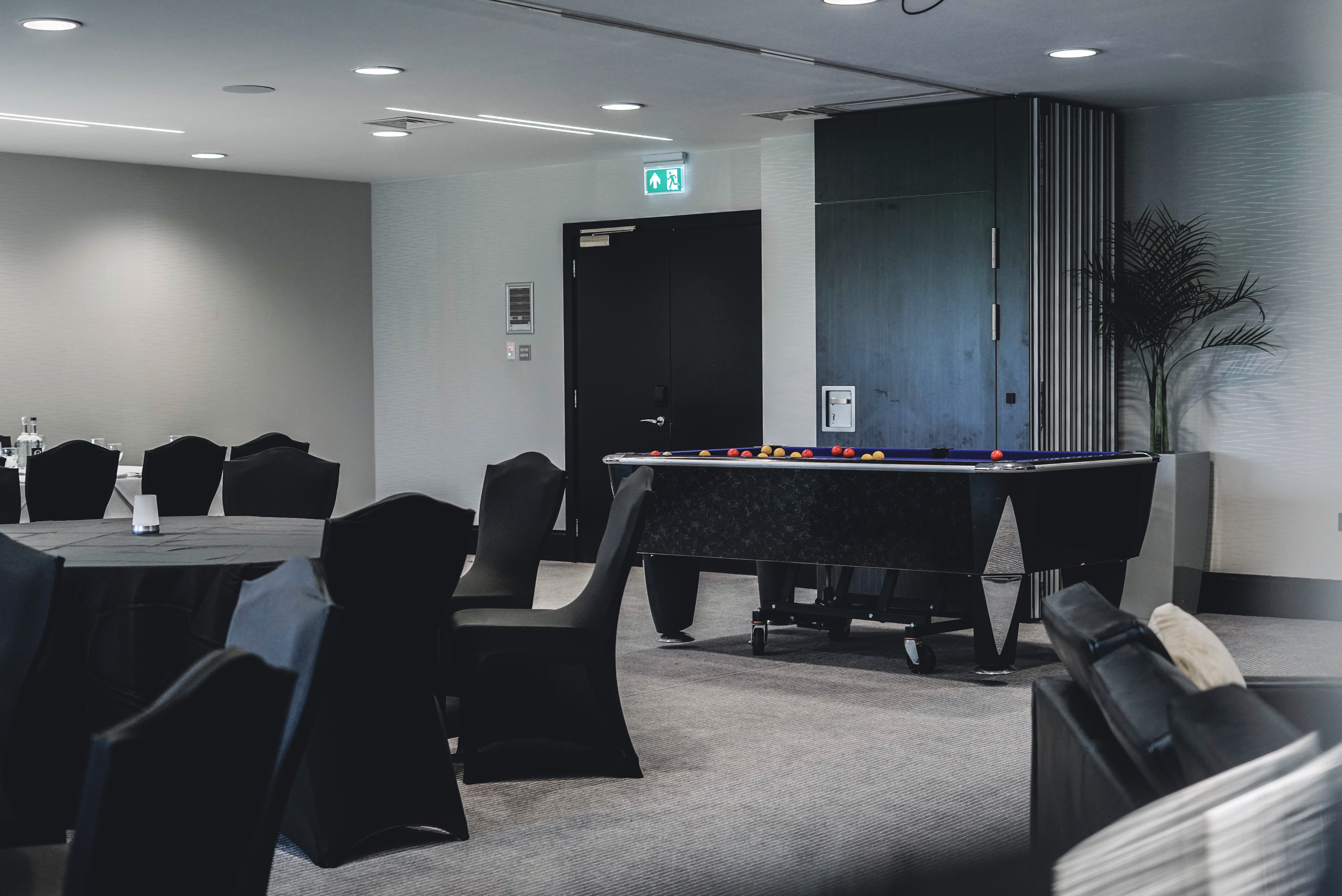 Versatile event space at Dukes, Hilton London Syon Park with modern decor and pool table.