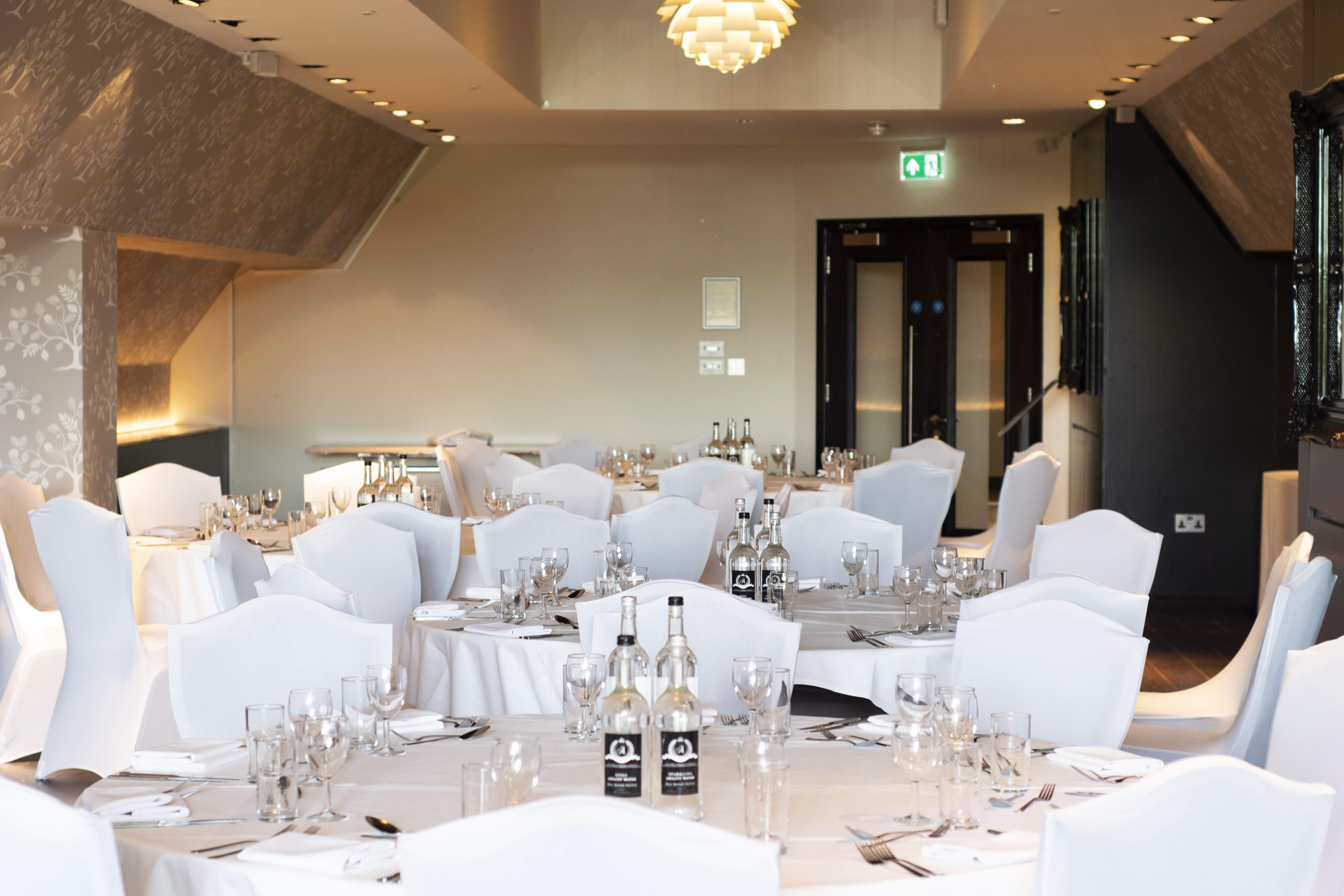 Elegant banquet room at The Clubhouse, Hilton London Syon Park for weddings and corporate events.