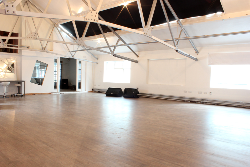 Versatile event space in Kraak Gallery with high ceilings for meetings and workshops.