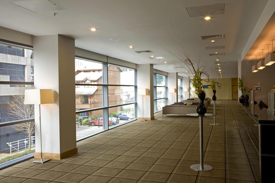 Quayside suite corridor at Hilton London, ideal for networking events with natural light.