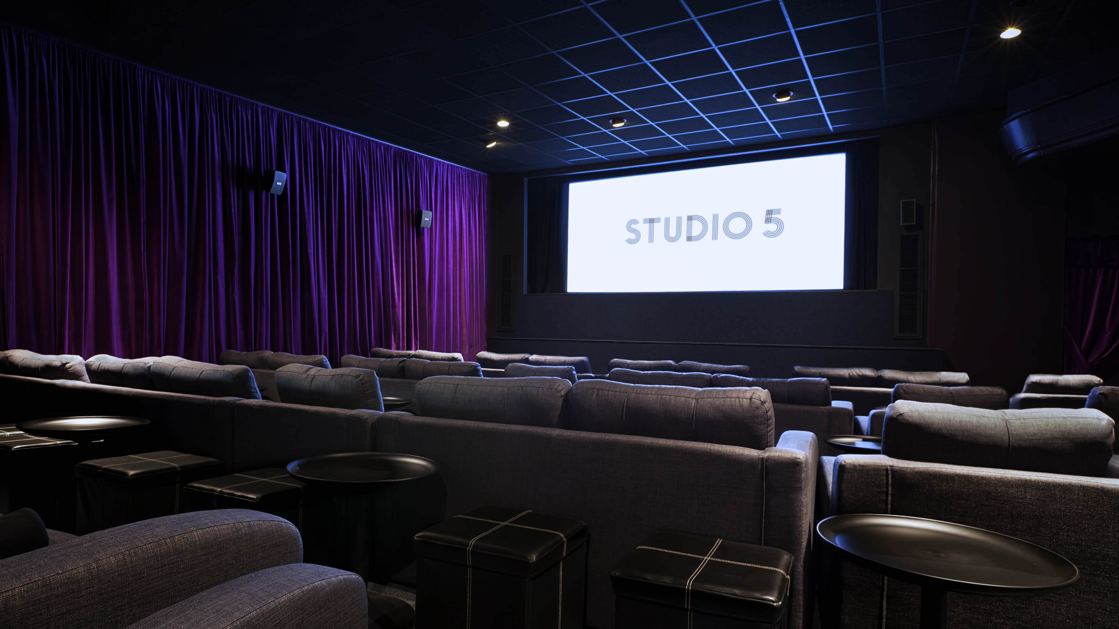 Modern screening room with plush seating for intimate film screenings and presentations.