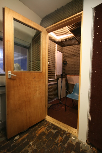 Soundproof recording booth at The Harrow Club for professional audio events and meetings.