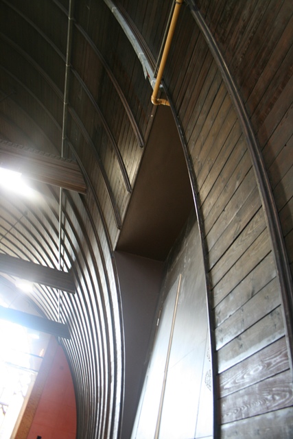 Sports Hall at The Harrow Club with curved wooden panels, ideal for events and gatherings.