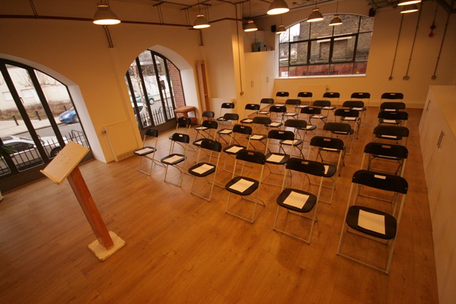 Conference Room at The Harrow Club with black chairs, ideal for seminars and workshops.