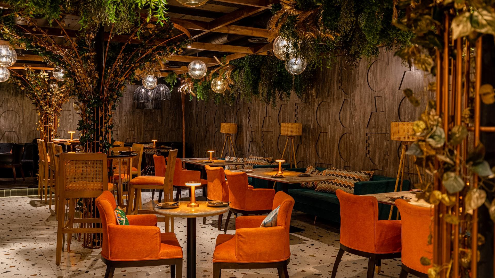 Biophilic Speakeasy venue with warm lighting, ideal for networking reception and VIP dinners.