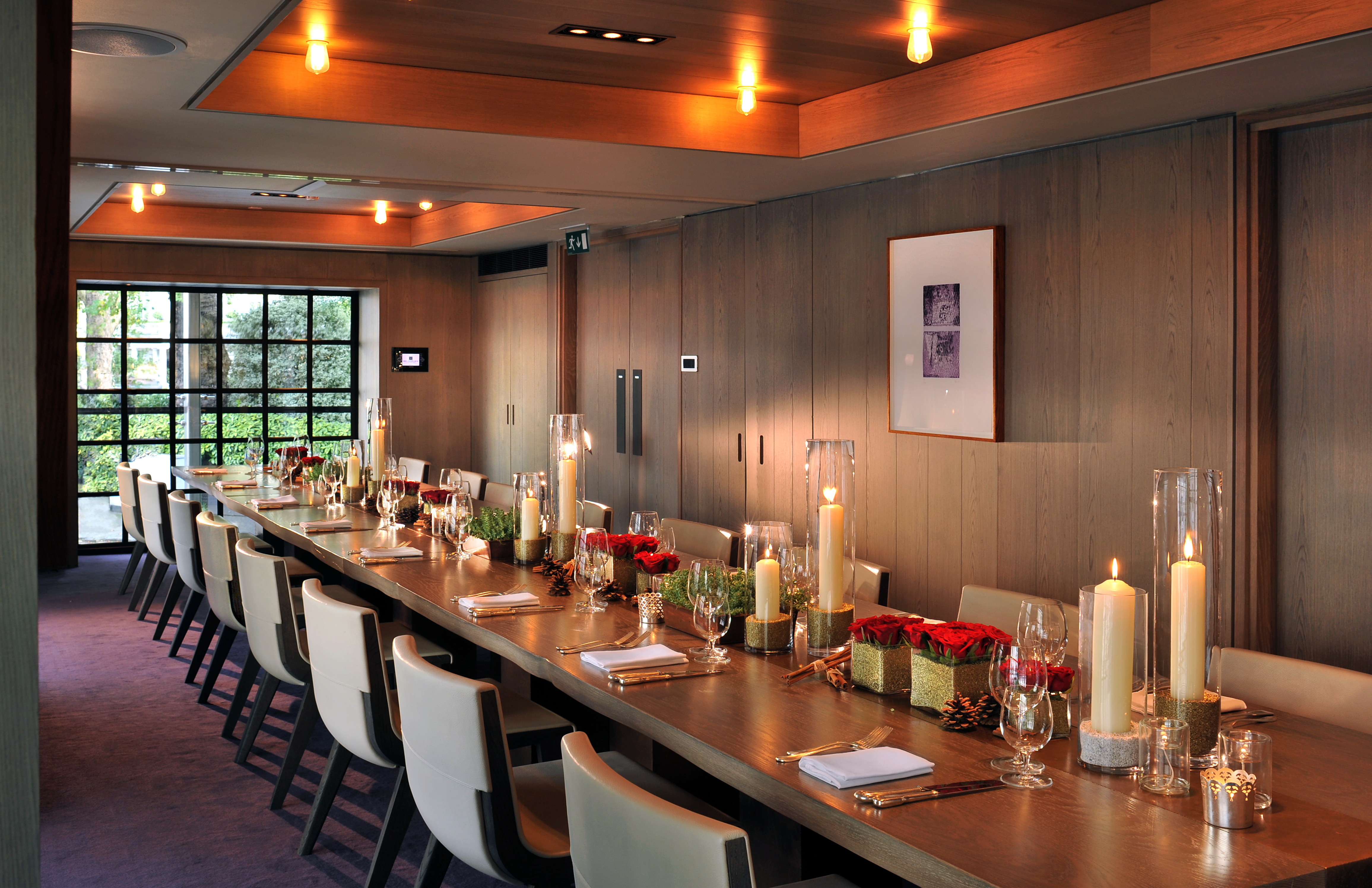 Sophisticated meeting space with elegant table, ideal for corporate events and private gatherings.