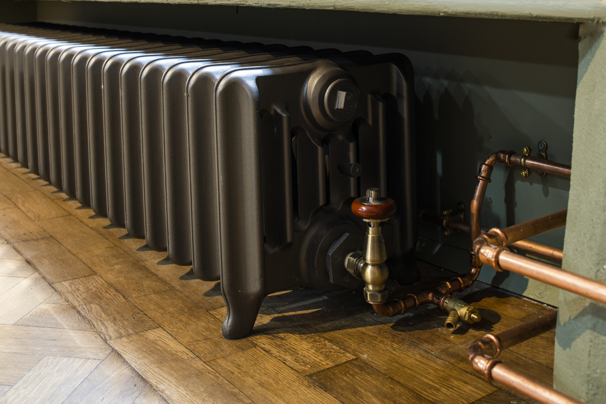 Vintage radiator in Ashbee Hall, Toynbee Hall - essential for event comfort and ambiance.