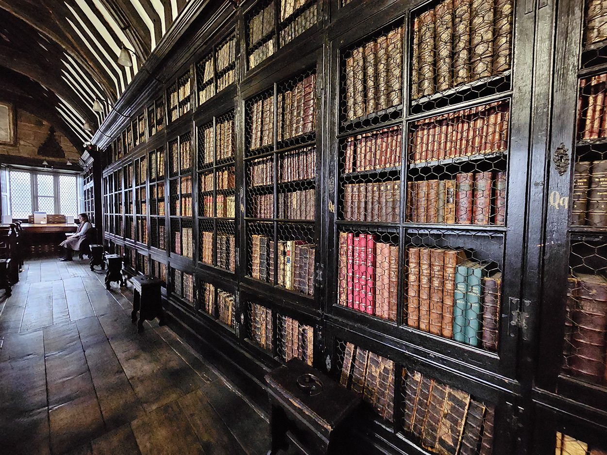 Baronial Hall in Chetham's Library, elegant antique books, ideal for literary events.