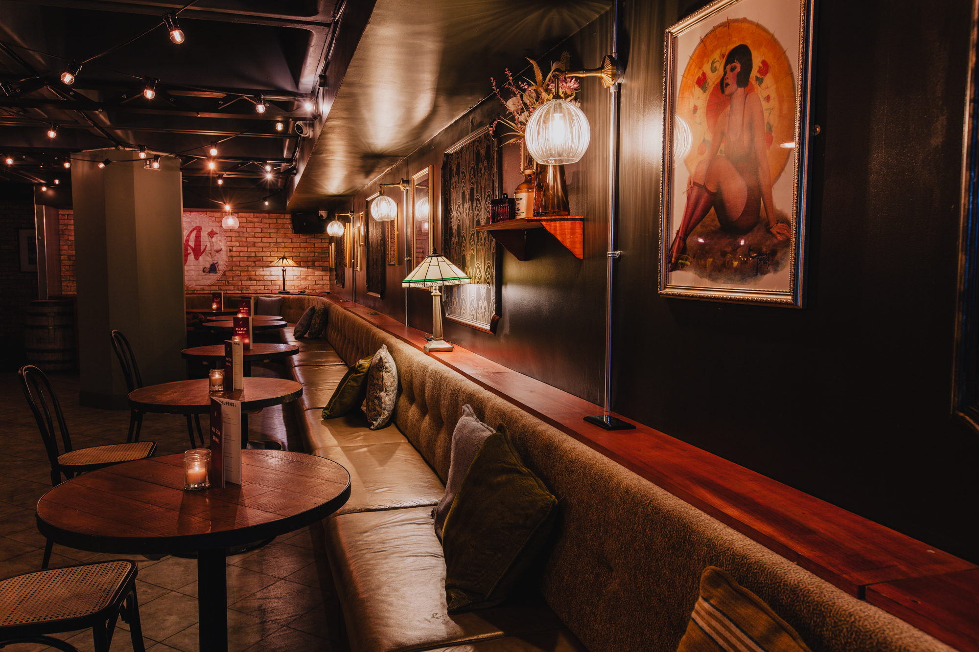 Stylish venue with cozy seating for intimate cocktail events at All Star Lanes, Brick Lane.