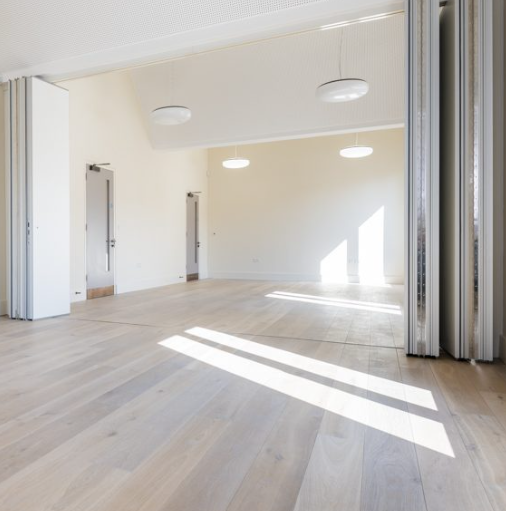 Versatile Meeting Room 2/3 at Toynbee Hall, bright space for events and gatherings.