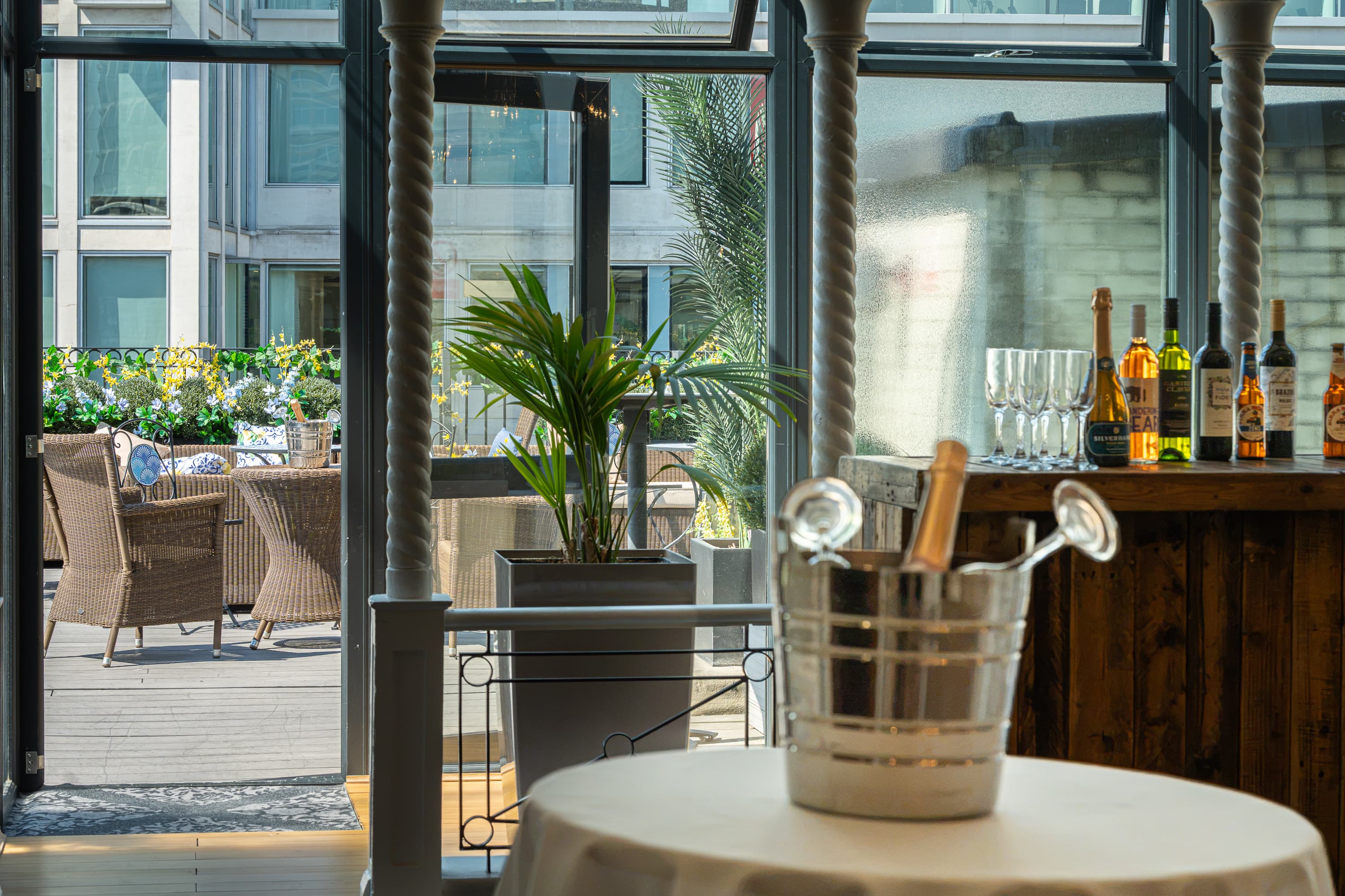 Corporate reception at Grand Connaught Rooms penthouse with terrace bar for business events.