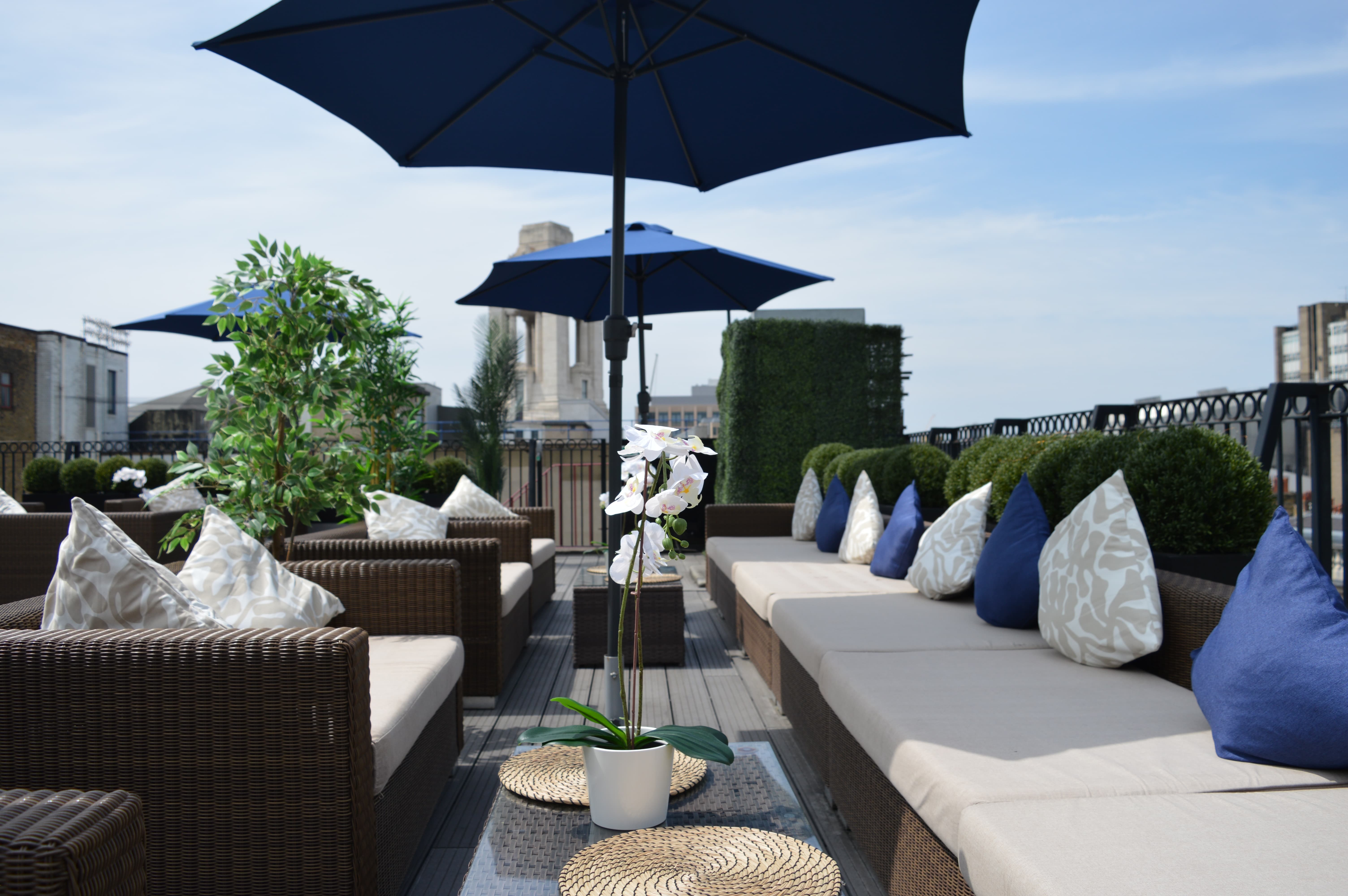 Rooftop networking reception at Grand Connaught Rooms with luxury lounge seating for corporate events.
