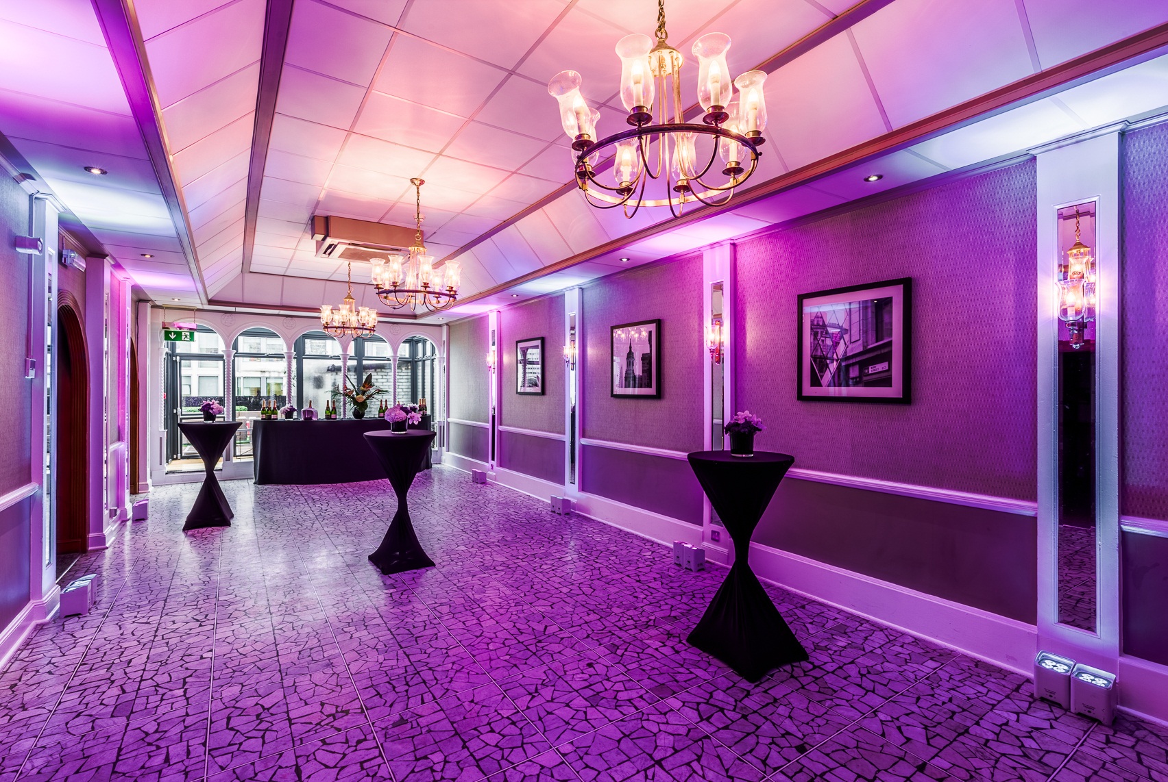 Penthouse event space with elegant purple decor for networking and cocktail receptions.