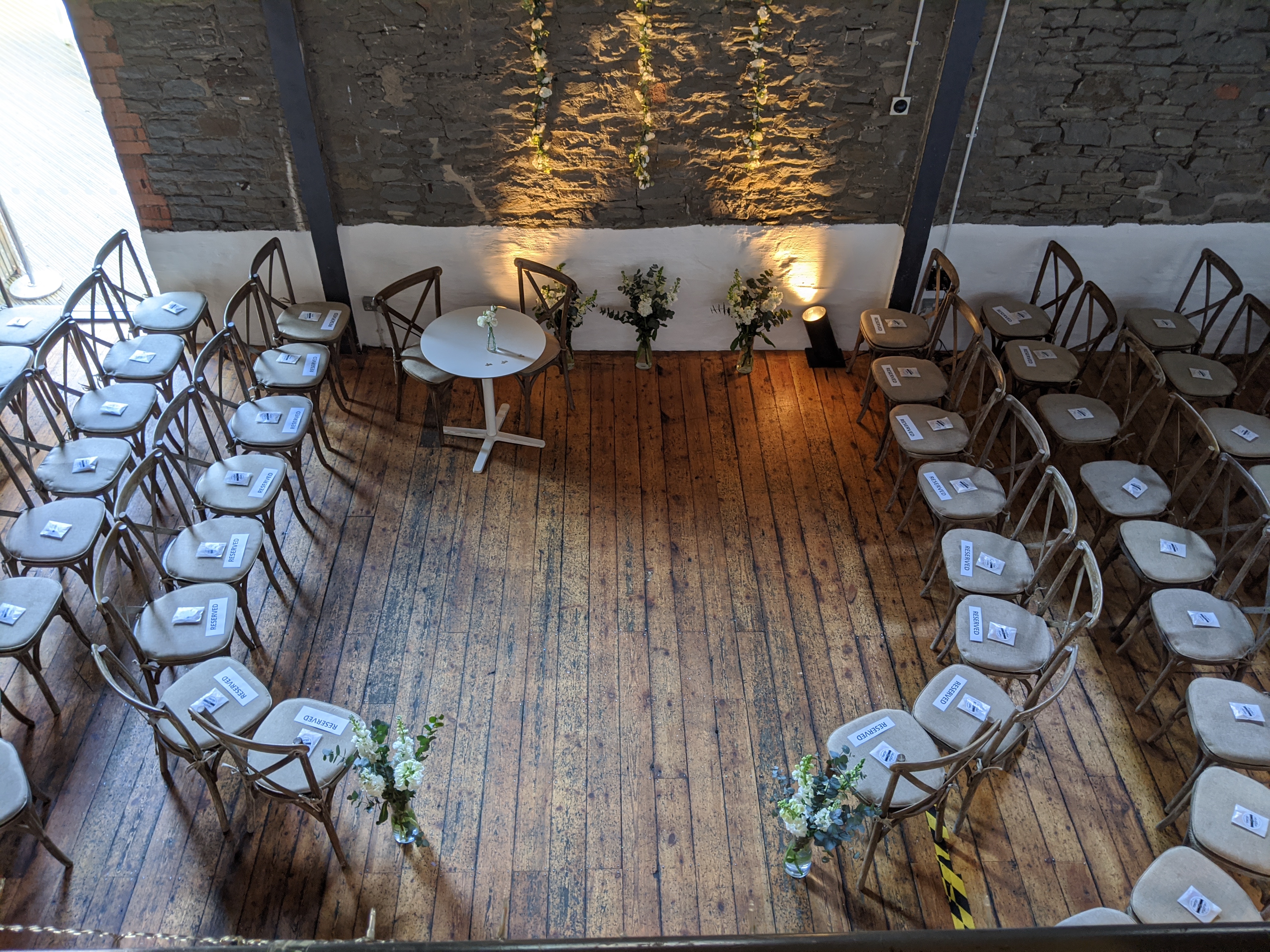 Event Space in Paintworks with aligned chairs, ideal for meetings and ceremonies.