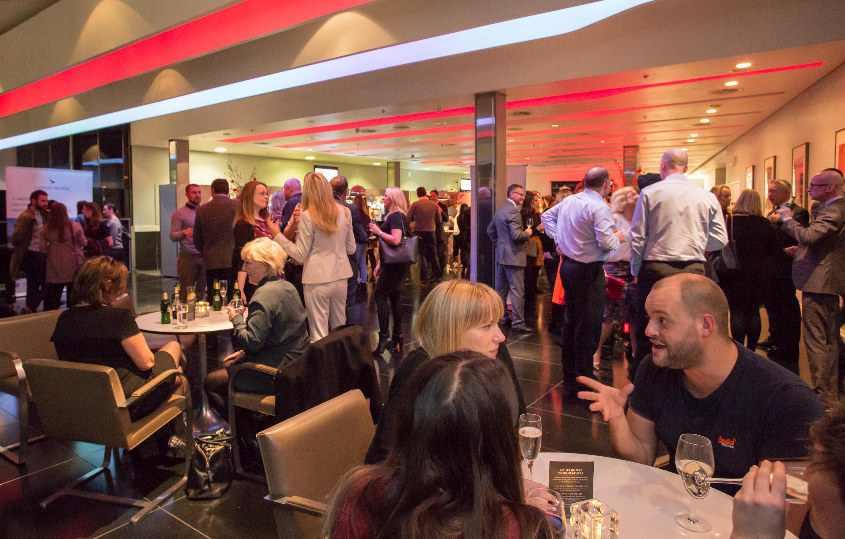 Vibrant networking event at The Second Floor Bar & Brasserie, modern venue with ambient lighting.