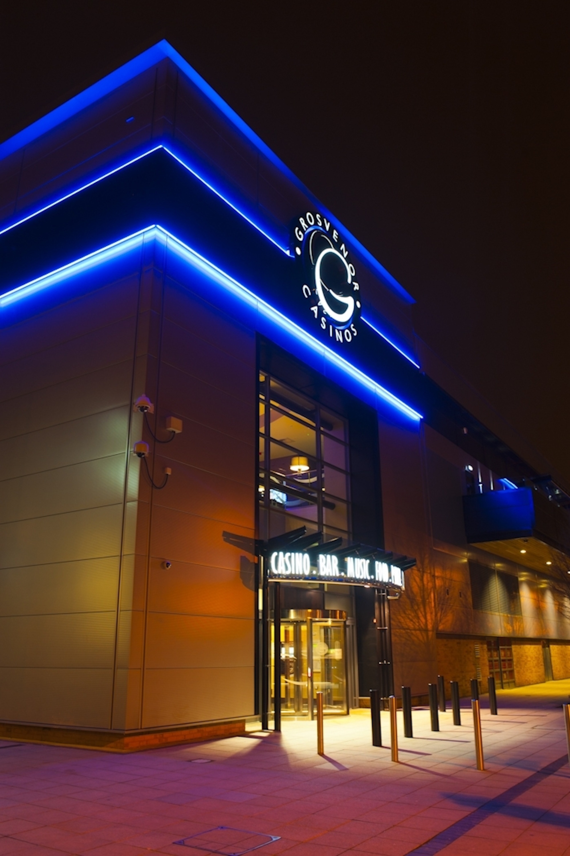 Modern casino lounge with blue lighting, perfect for corporate and social events.