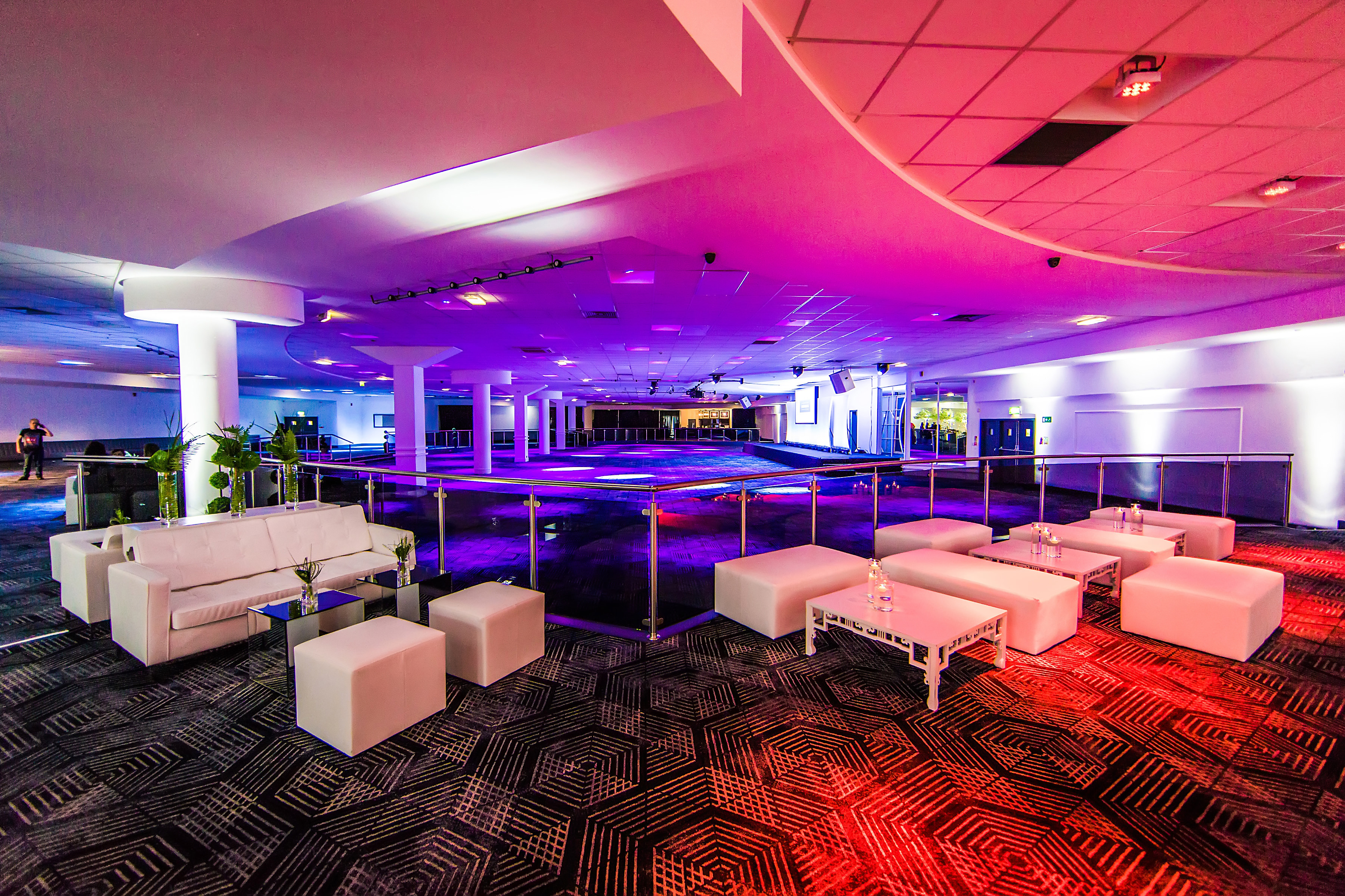 Versatile event space in The Sheridan with sleek white lounge furniture for gatherings.
