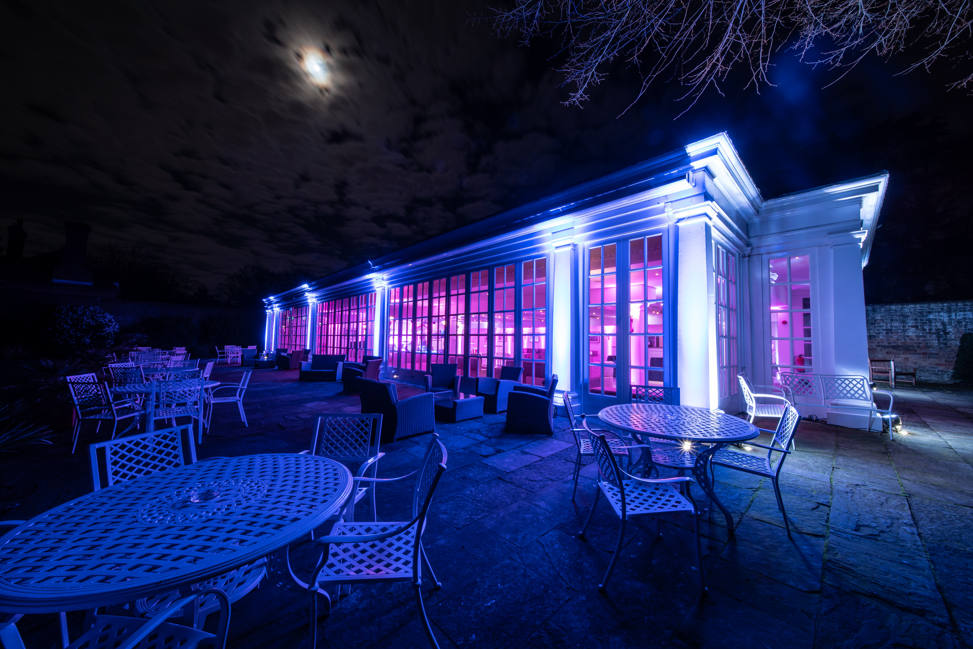 The Garden Room at Hampton Court Palace, vibrant lighting for elegant evening events.