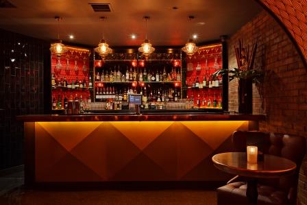 Stylish cocktail cabinet in warm lighting for networking events and receptions.