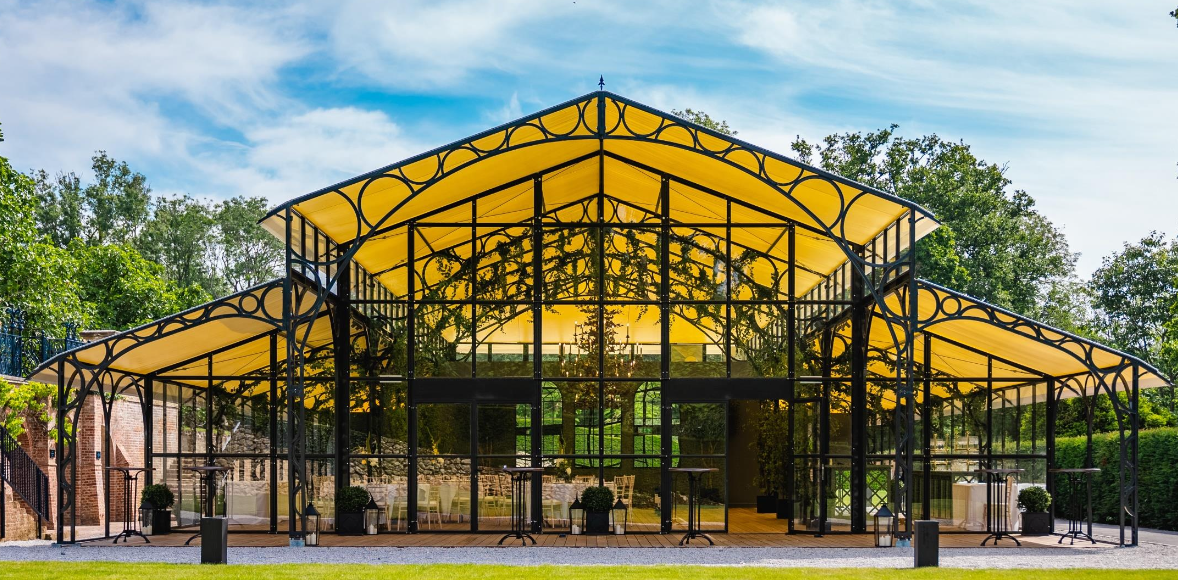 Elegant glass pavilion at Port Lympne Hotel, perfect for weddings and events.