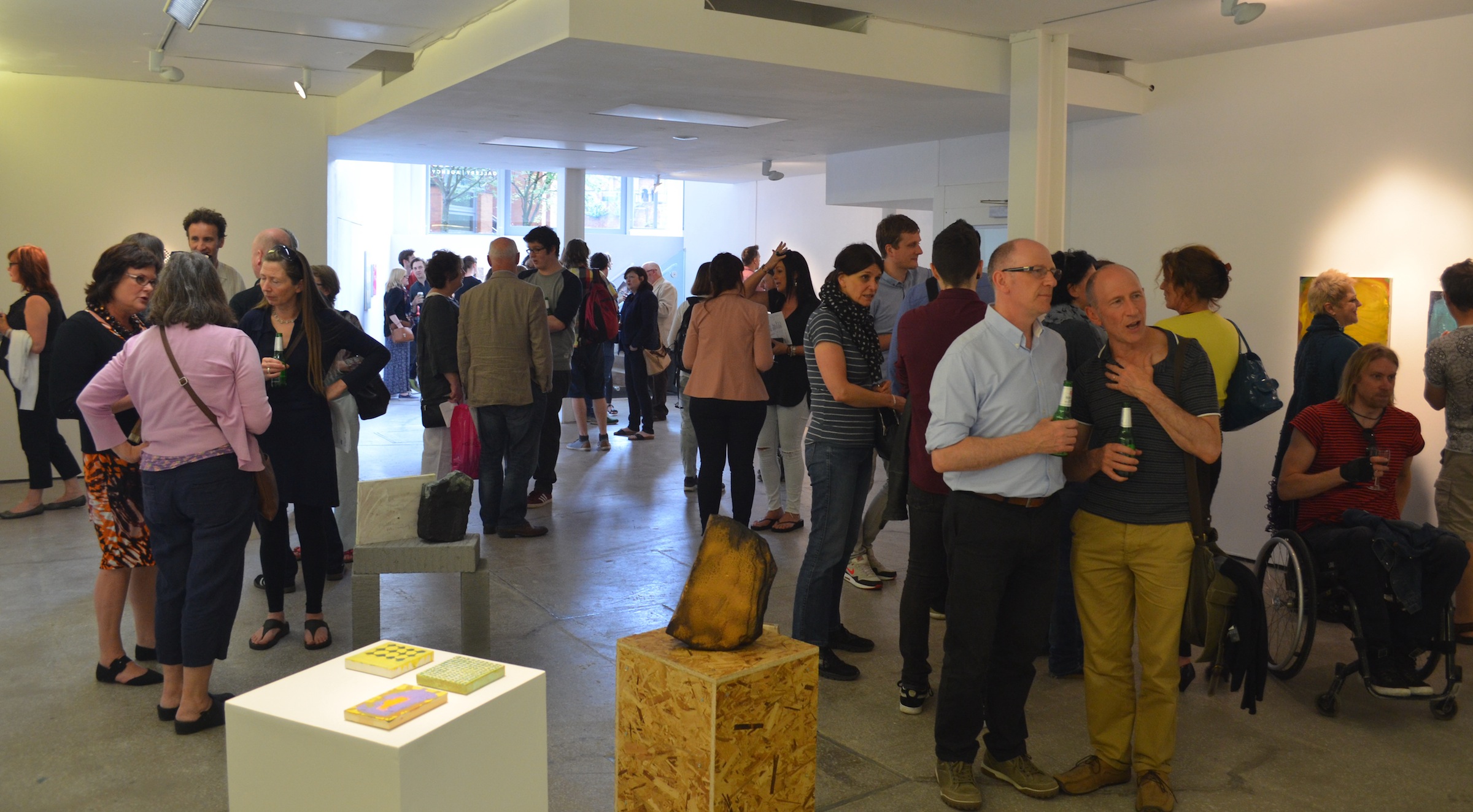 Vibrant Castlefield Gallery venue with attendees at a networking art event.
