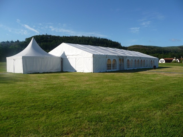 Outdoor event setup at Cultybraggan POW Camp with marquee, ideal for weddings and festivals.