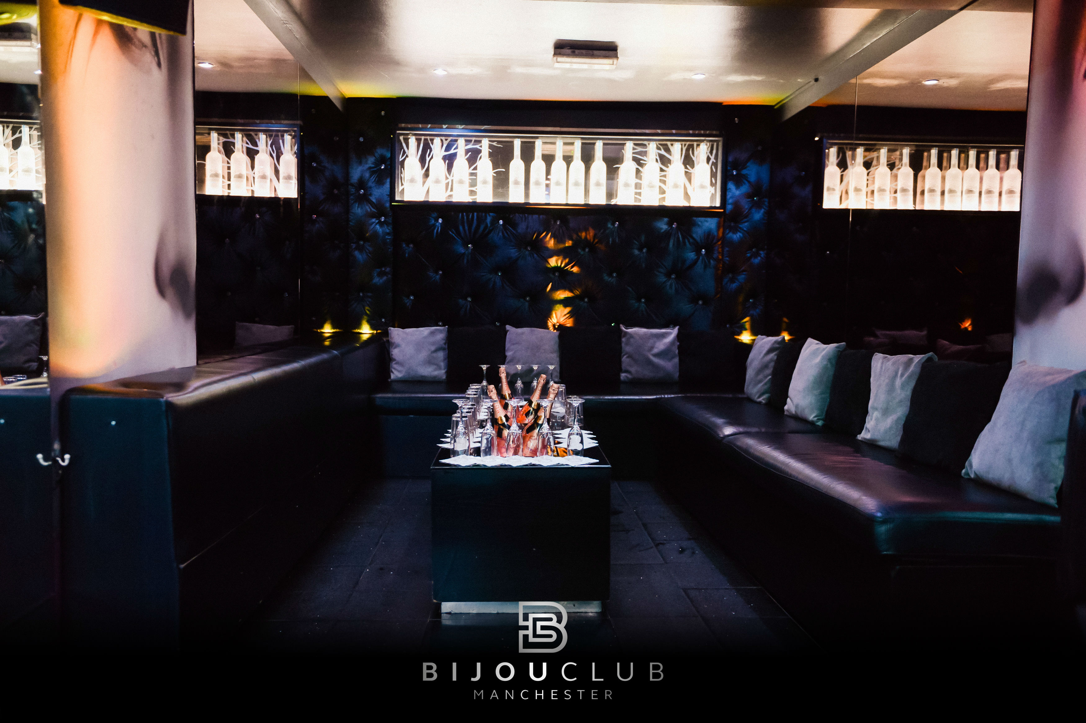 Stylish cocktail bar lounge with plush seating for upscale private events and mixers.