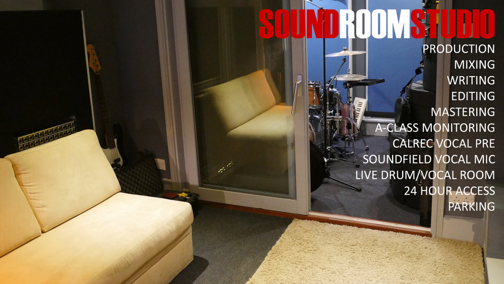 Professional sound studio with glass walls, ideal for meetings and workshops.