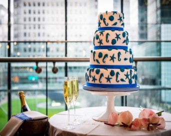 Elegant four-tier cake in The Pearson Room for a sophisticated event celebration.