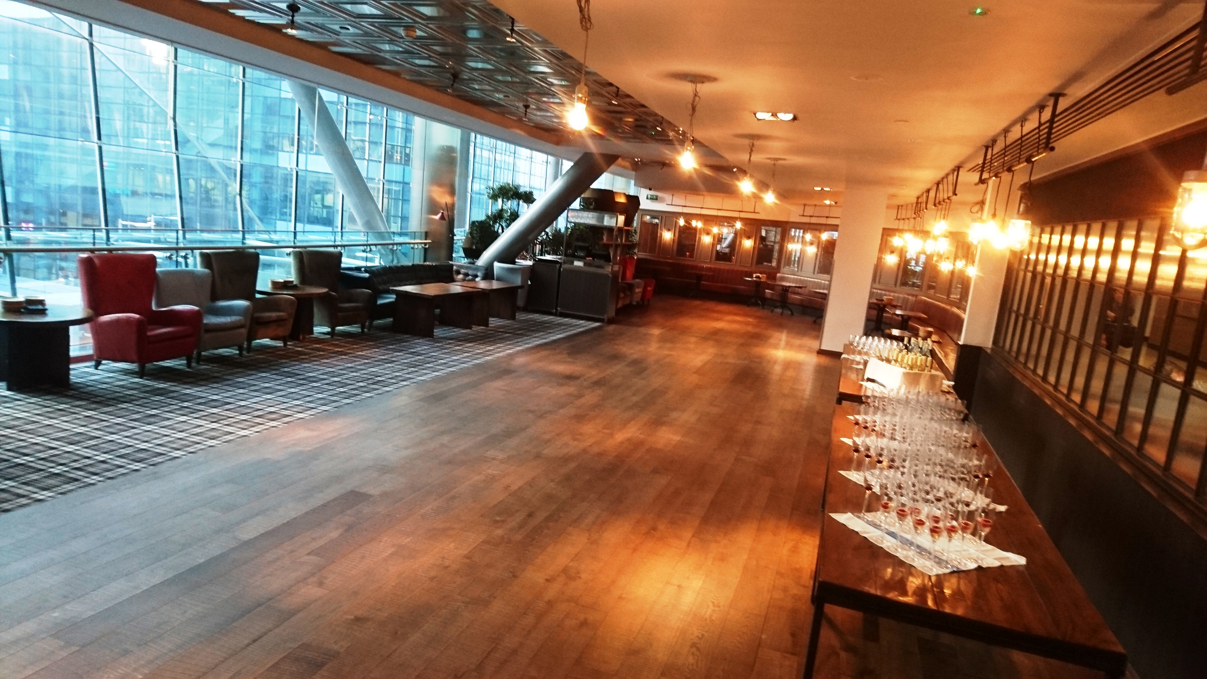 Modern event venue with large windows, perfect for upscale corporate gatherings.