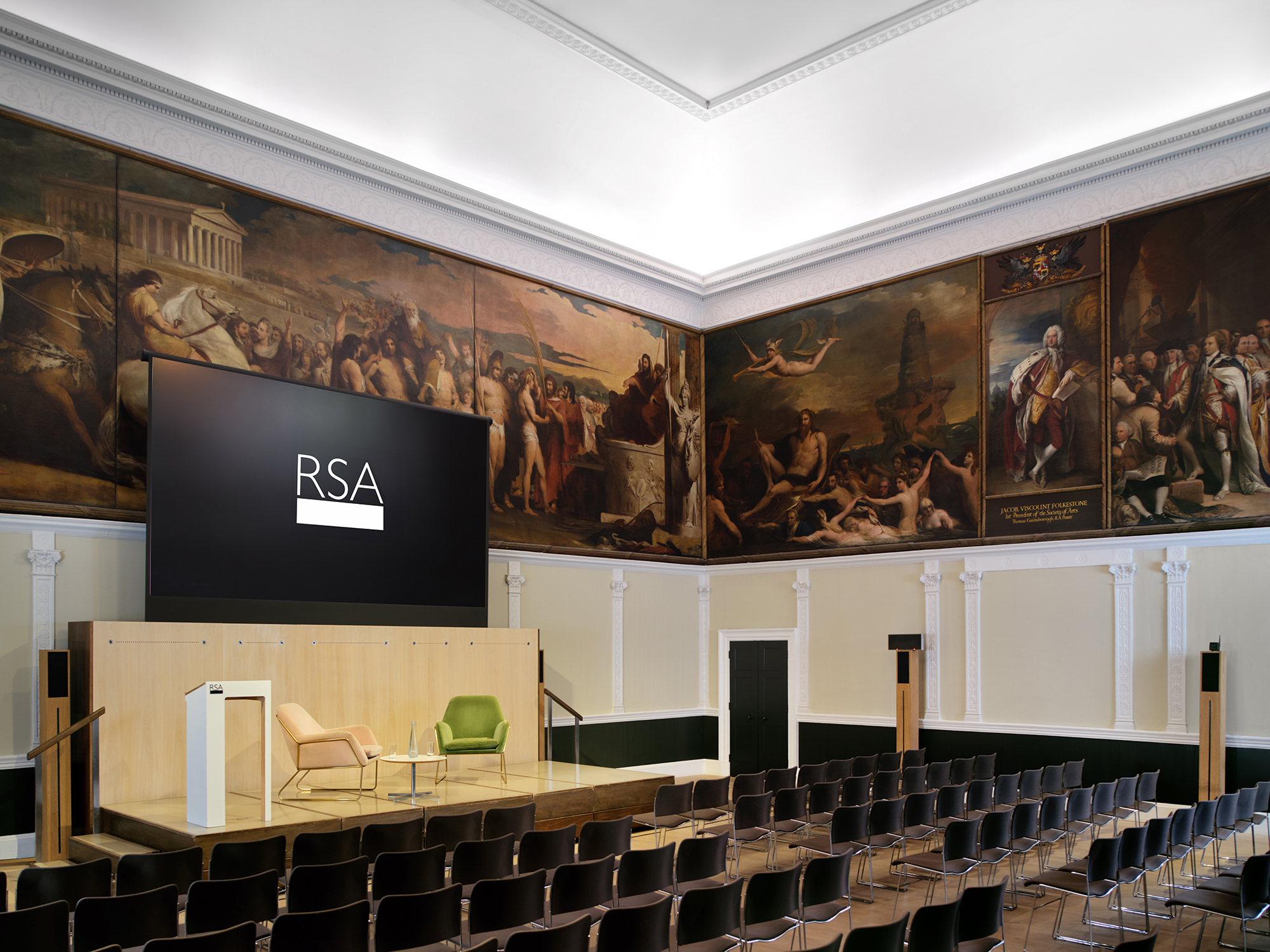 Great Room at RSA House with elegant seating and large screen for conferences.